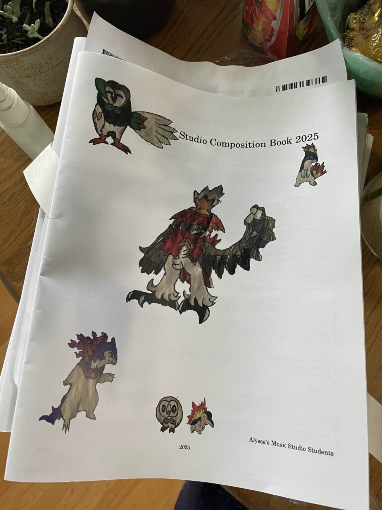 A picture of the covers of the studio composition books